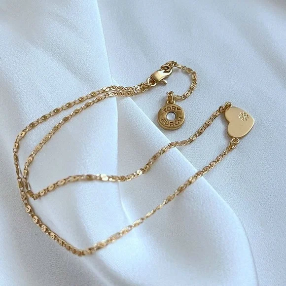 Tory Burch Elegant Gold Necklace with Heart and Disc Charms - Picture 1 of 7